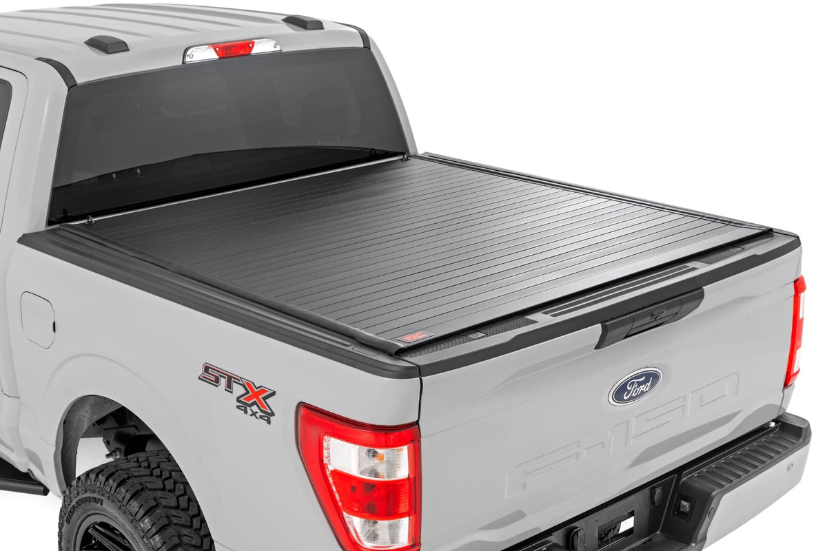 Rough Country 50221550 Hard Roll Up Bed Cover | 5'7" Bed | Ford F-150 (15-26)/F-150 Lightning (22-26) - Studio View 1