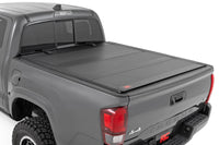 Hard Tri-Fold Flip Up Bed Cover | 5' Bed | Toyota Tacoma 2WD/4WD (2005-2015) - Bed Covers (Image 1 of 6)