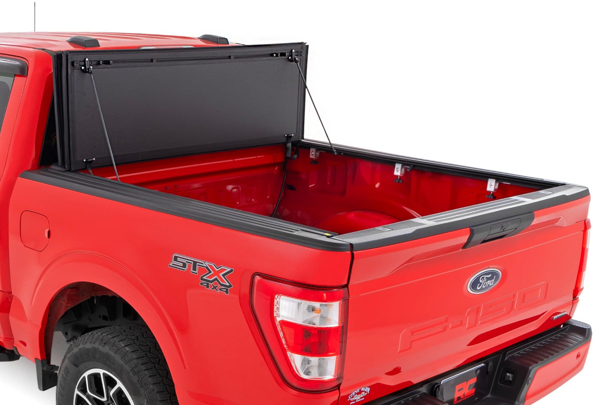 Rough Country 49225650_A Hard Tri-Fold Flip Up Bed Cover | 6'7" Bed | Ford F-150 2WD/4WD (2015-2020) - Studio View 2