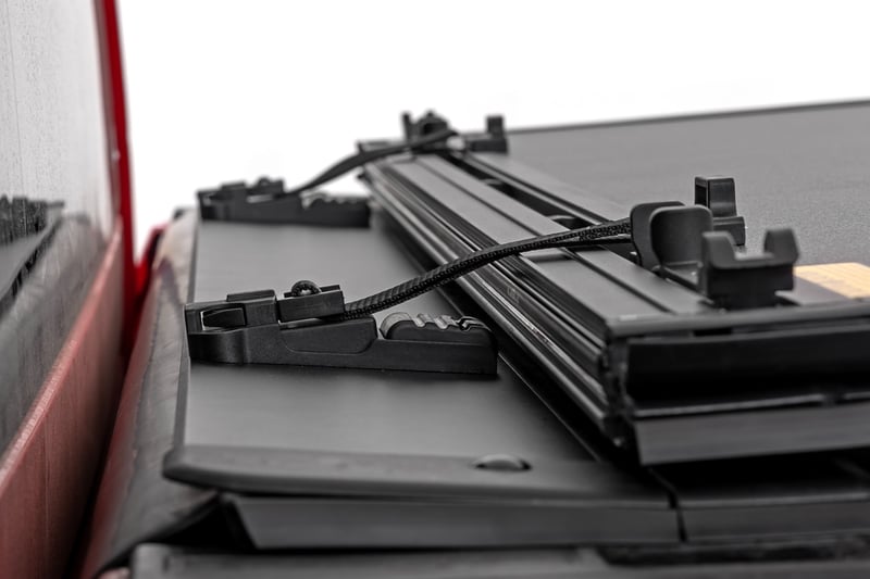 RC Hard Tri-Fold Flip Up Bed Cover | 5' Bed | Nissan Frontier 2WD/4WD (22-26) (manufacturer page)