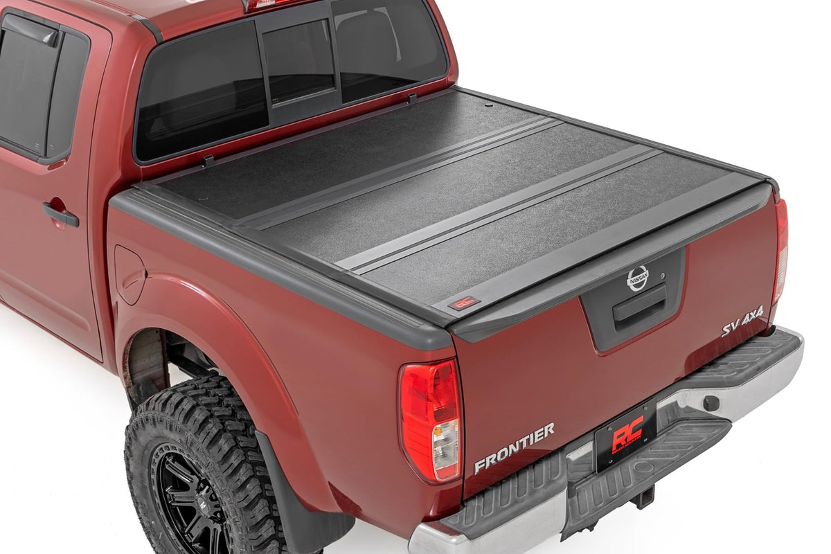 Hard Low Profile Bed Cover | 5' Bed | Cargo Mgmt | Nissan Frontier (05-21) - Bed Covers (Image 1 of 6)