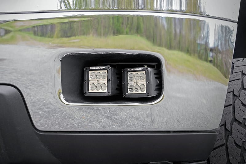 RC LED Light Kit | Fog Mount | 2" Black Pair | White DRL | Chevy Silverado 2500 HD/3500 HD (11-14) (manufacturer page)