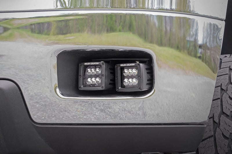 RC LED Light Kit | Fog Mount | 2" Black Pair | White DRL | Chevy Silverado 2500 HD/3500 HD (11-14) (manufacturer page)