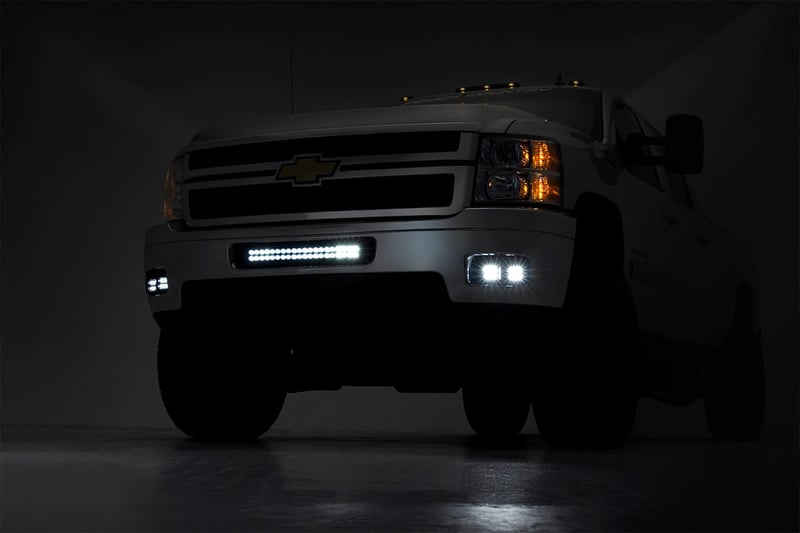 RC LED Light Kit | Fog Mount | 2" Black Pair | Amber DRL | Chevy Silverado 2500 HD/3500 HD (11-14) (manufacturer page)