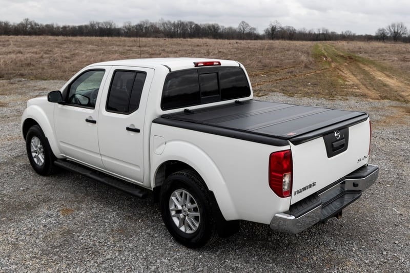 RC Hard Tri-Fold Flip Up Bed Cover | 5' Bed | Nissan Frontier 2WD/4WD (05-21) (manufacturer page)