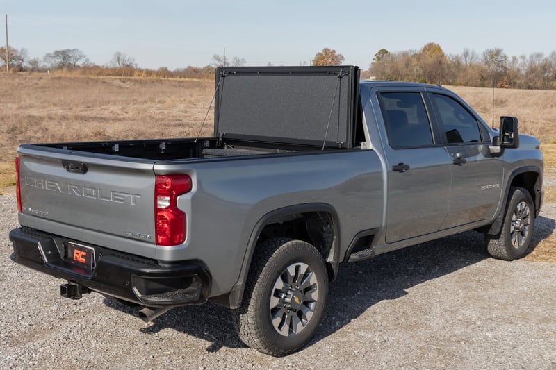 RC Hard Tri-Fold Flip Up Bed Cover | 6'9" Bed | Chevy/GMC Silverado/Sierra 2500HD/3500HD (20-26) (manufacturer page)