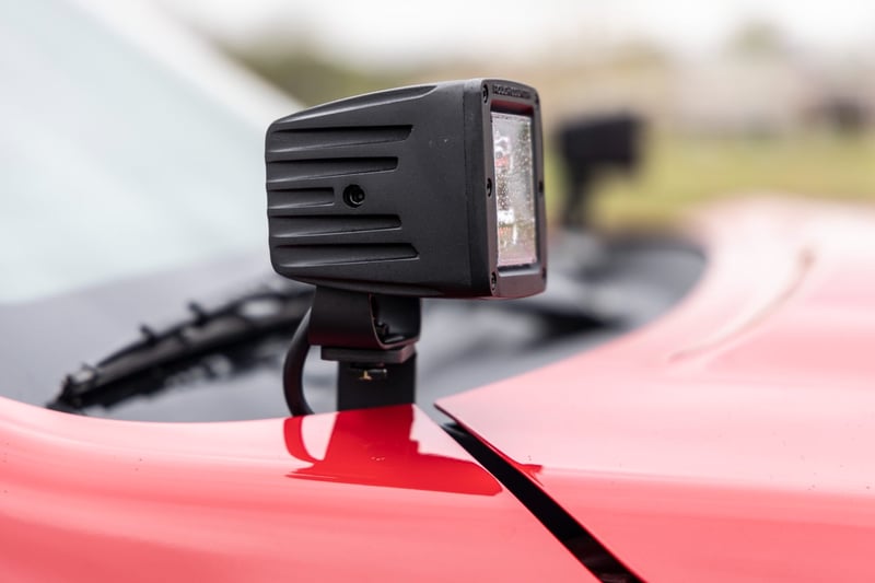 RC LED Light Kit | Ditch Mount | 2" Black Pair | Amber DRL | Nissan Frontier (22-26) (manufacturer page)