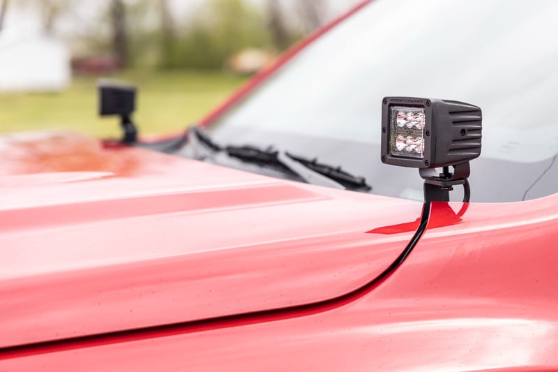 RC LED Light Kit | Ditch Mount | 2" Black Pair | Amber DRL | Nissan Frontier (22-26) (manufacturer page)