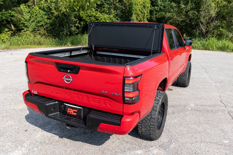 RC Hard Tri-Fold Flip Up Bed Cover | 5' Bed | Nissan Frontier 2WD/4WD (22-26) (manufacturer page)