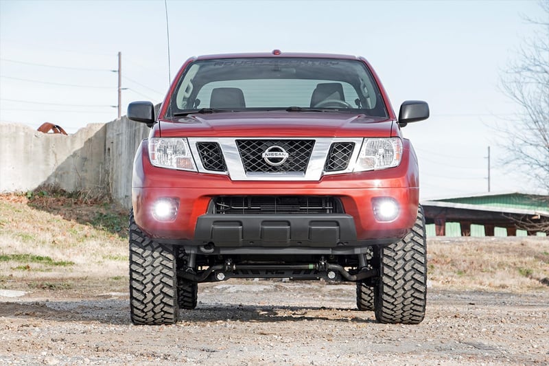 RC LED Light Kit | Fog Mount | 2" Black Pair | Spot | Nissan Frontier (05-20) (manufacturer page)